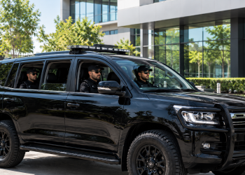 Tactical SUV Outside Modern Office Building